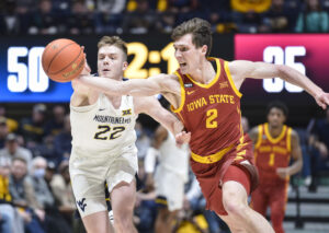 Huggins' mission is to finish season with players who show desire, as WVU travels to Iowa State